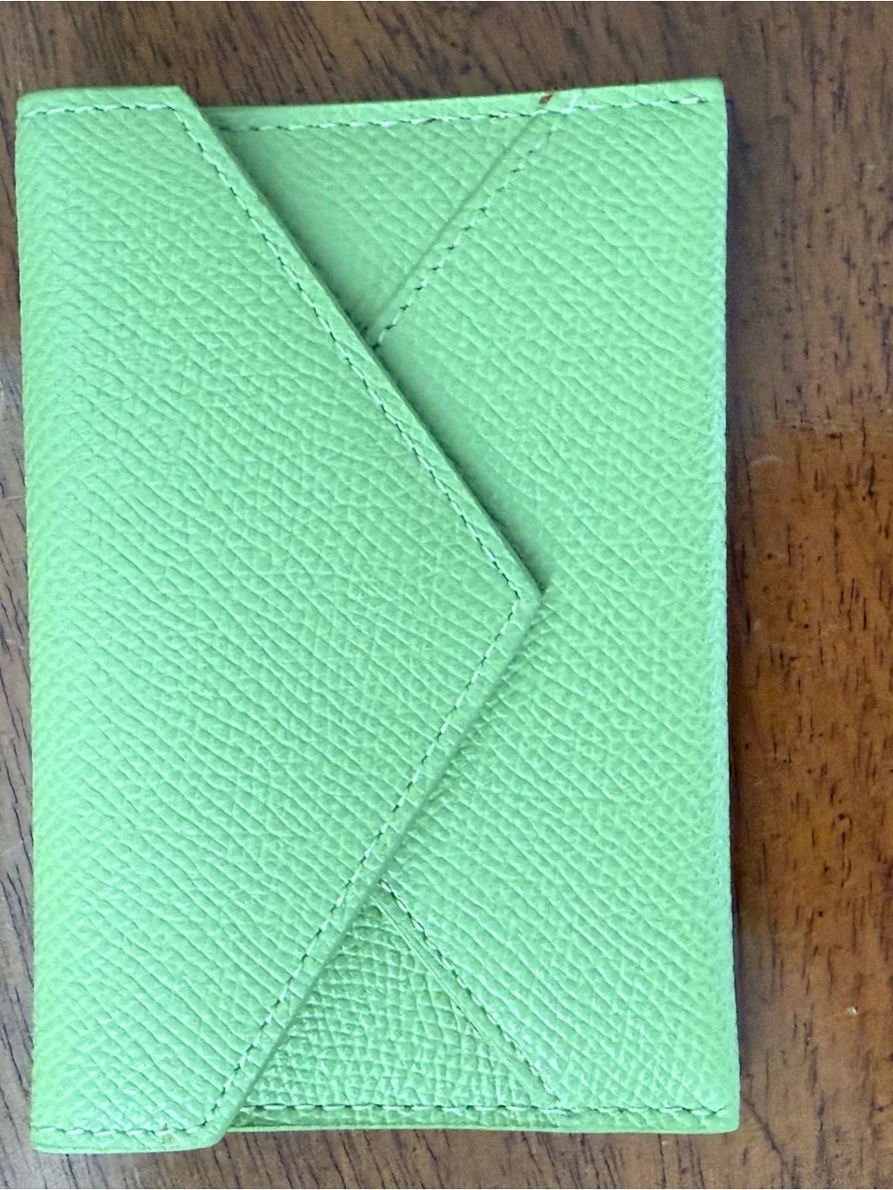 Set of 2 Dooney and Bourke Apple green leather envelopes. Gently used.